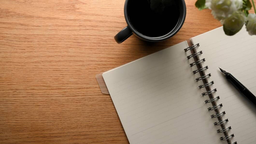 A blank notebook with a plant